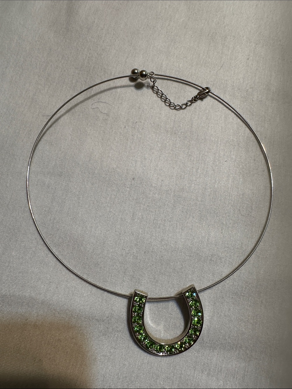 Silver Horseshoe Necklace with Green Crystal Accent
